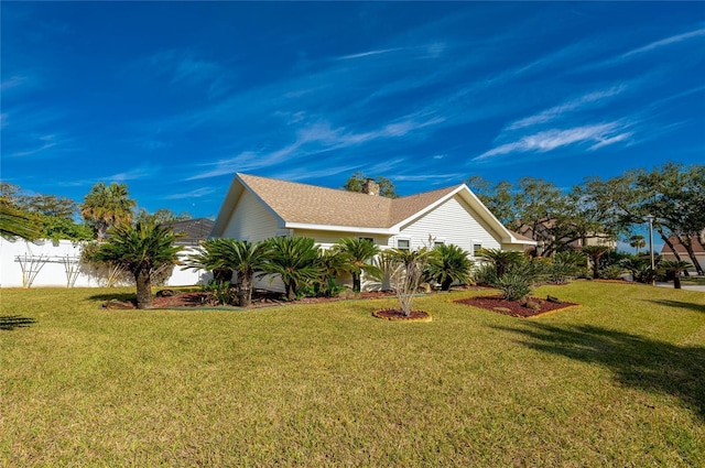 view of property exterior with a yard