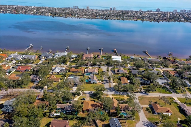 birds eye view of property with a water view