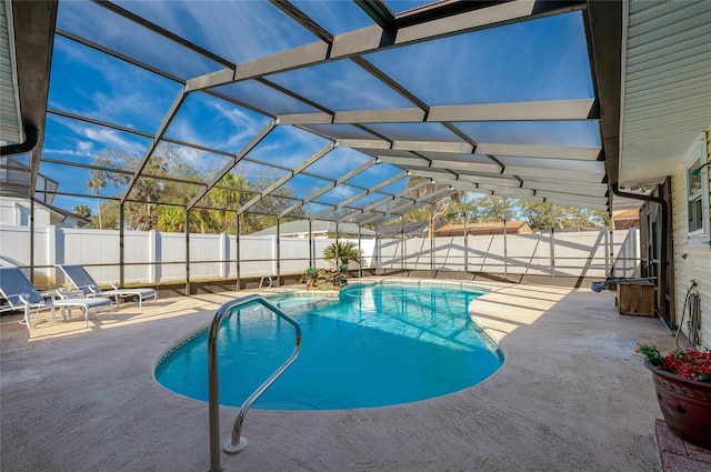 view of pool with a lanai and a patio