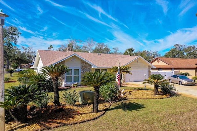 ranch-style home with a garage and a front yard