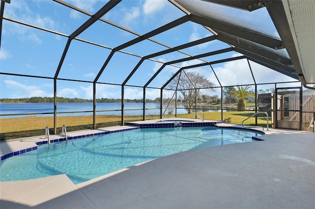 view of pool with a patio, a water view, and glass enclosure