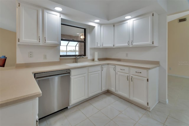 kitchen with sink, stainless steel dishwasher, and white cabinets