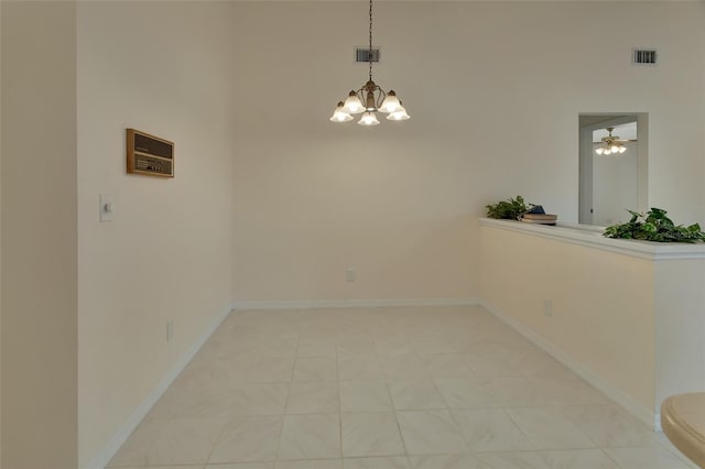 unfurnished dining area featuring a chandelier