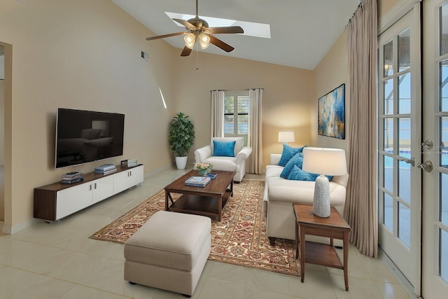 living room featuring a water view, lofted ceiling, ceiling fan, and french doors