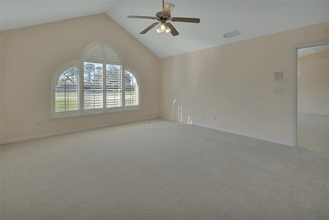 carpeted empty room featuring high vaulted ceiling and ceiling fan