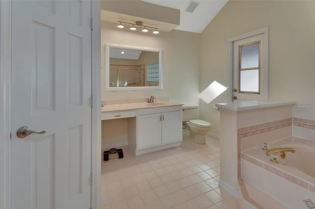 bathroom featuring vaulted ceiling, tile patterned flooring, vanity, toilet, and tiled tub