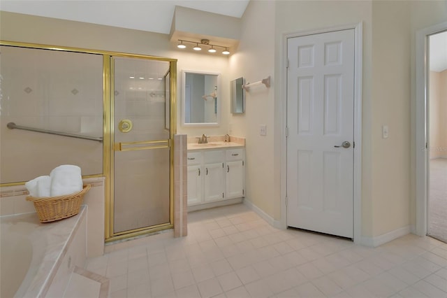 bathroom with vanity and shower with separate bathtub