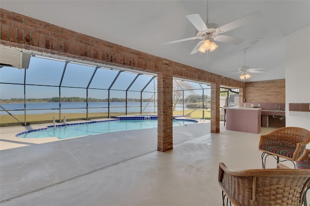 view of pool featuring a water view