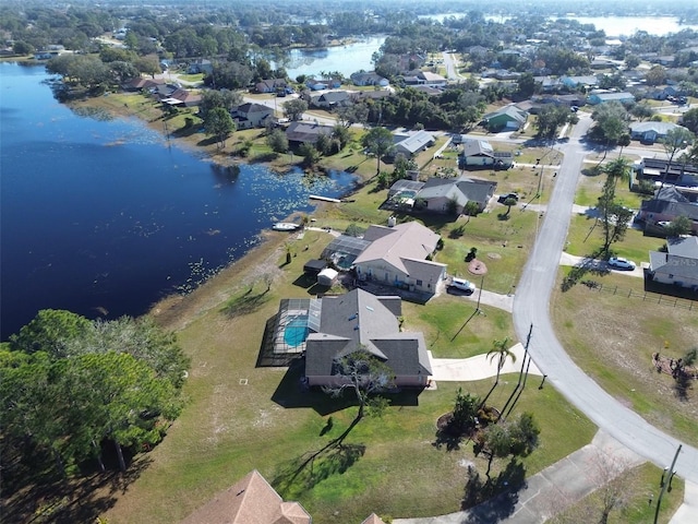 birds eye view of property with a water view