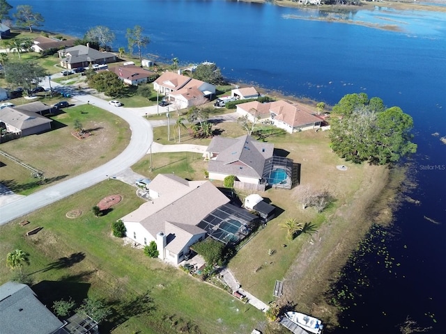 drone / aerial view with a water view