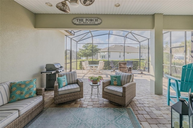 view of patio / terrace with outdoor lounge area, ceiling fan, a grill, and a lanai