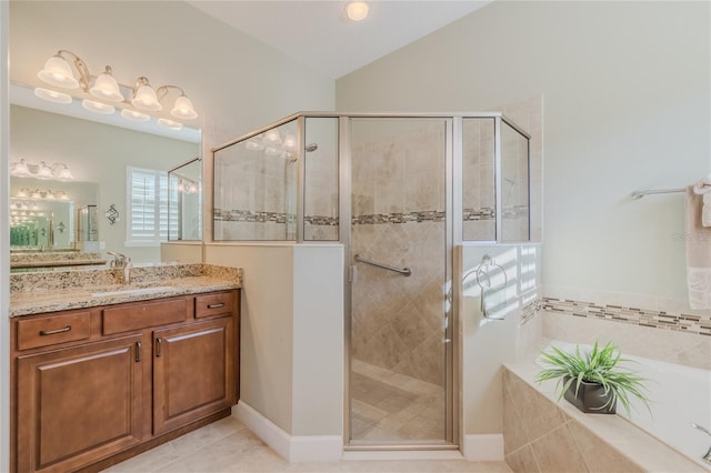 bathroom featuring tile patterned floors, vanity, shower with separate bathtub, and vaulted ceiling