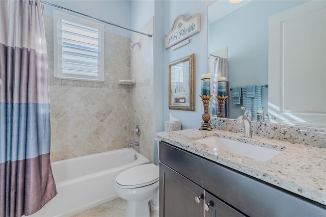 full bathroom featuring shower / tub combo with curtain, vanity, and toilet