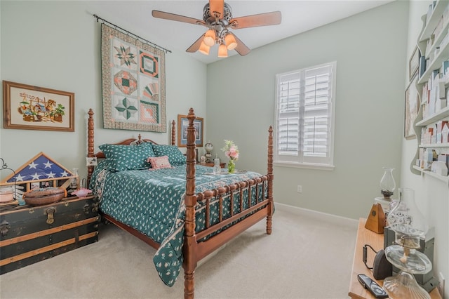 bedroom with ceiling fan and carpet floors