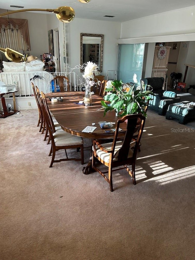 dining area featuring carpet flooring