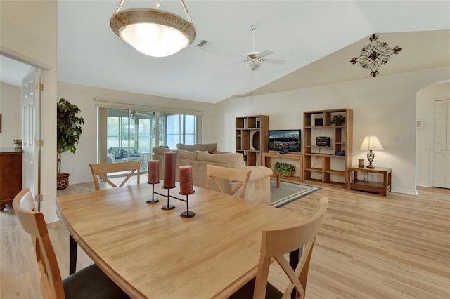 dining space with lofted ceiling, hardwood / wood-style floors, and ceiling fan