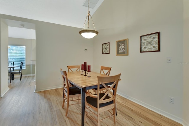 dining room with light hardwood / wood-style floors