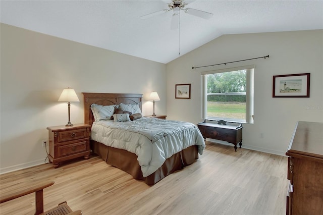 bedroom featuring lofted ceiling, ceiling fan, and light hardwood / wood-style flooring