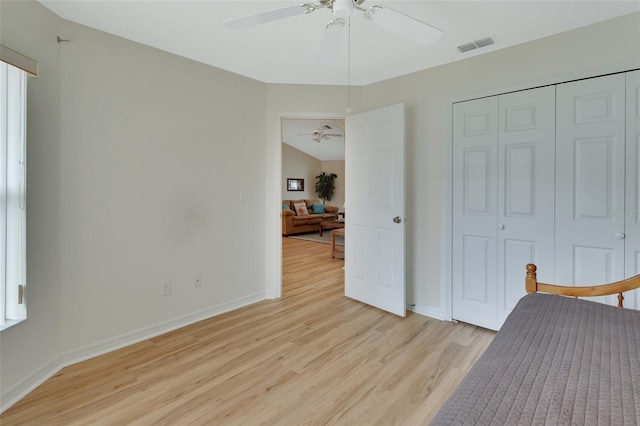 unfurnished bedroom with a closet, ceiling fan, and light hardwood / wood-style flooring