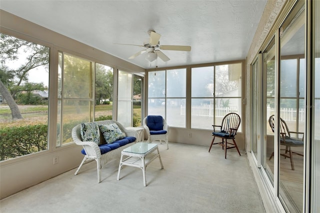 sunroom featuring ceiling fan