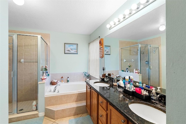 bathroom with vanity, tile patterned floors, and plus walk in shower