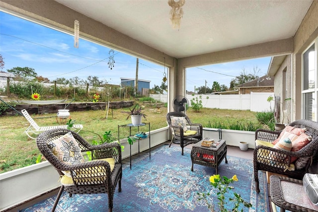 sunroom / solarium featuring a healthy amount of sunlight