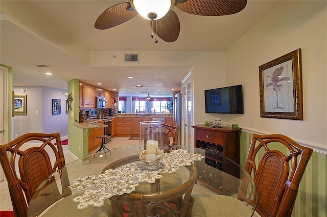 dining space featuring ceiling fan