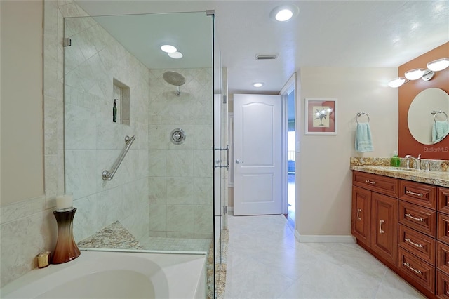 bathroom with independent shower and bath and vanity