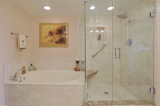 bathroom with separate shower and tub