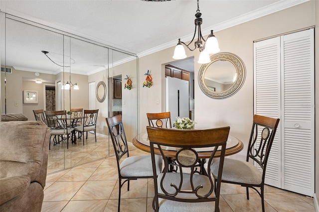 tiled dining room with crown molding and an inviting chandelier