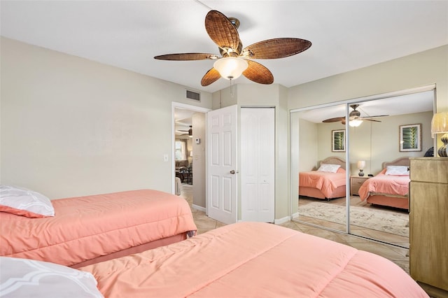 bedroom featuring light tile patterned floors and ceiling fan