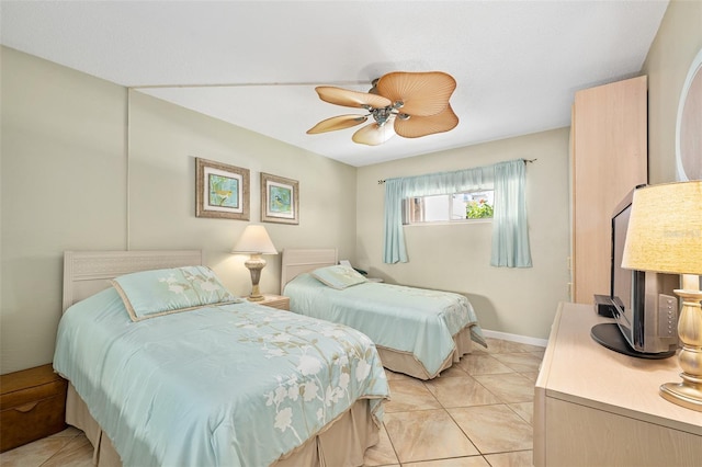 tiled bedroom with ceiling fan