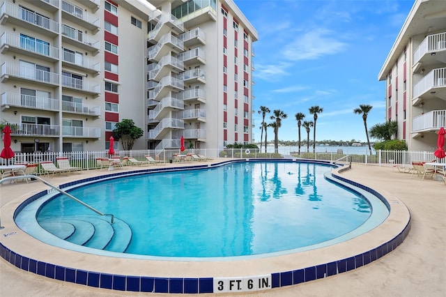 view of swimming pool with a patio area