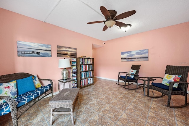 living area featuring ceiling fan