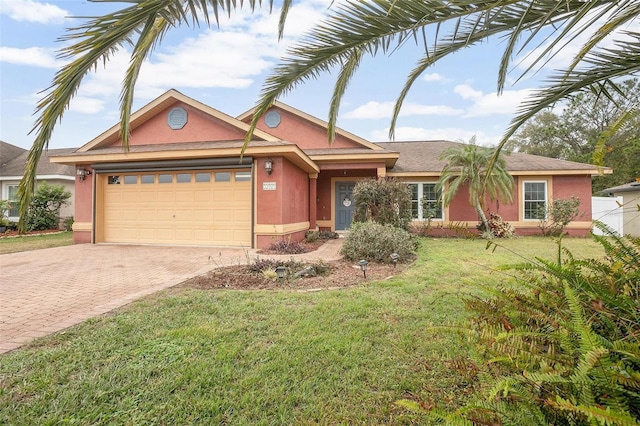 view of front of house featuring a garage and a front lawn