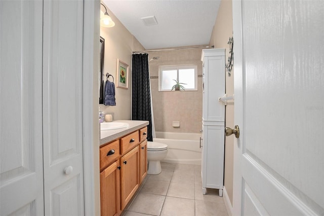 full bathroom featuring tile patterned flooring, vanity, shower / tub combo, toilet, and a textured ceiling