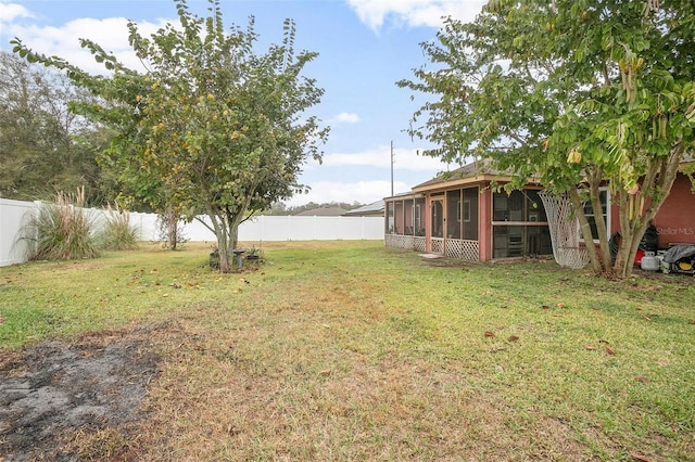 view of yard featuring a sunroom