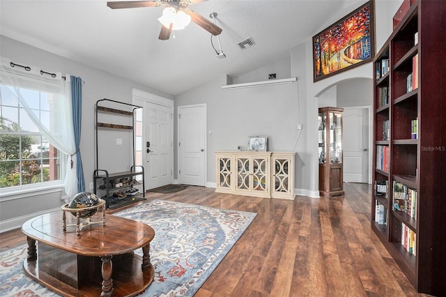 sitting room with ceiling fan, lofted ceiling, and dark hardwood / wood-style floors