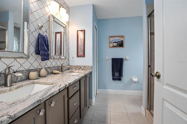 bathroom with vanity, backsplash, tile patterned floors, and walk in shower