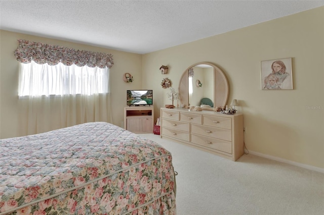 carpeted bedroom with a textured ceiling