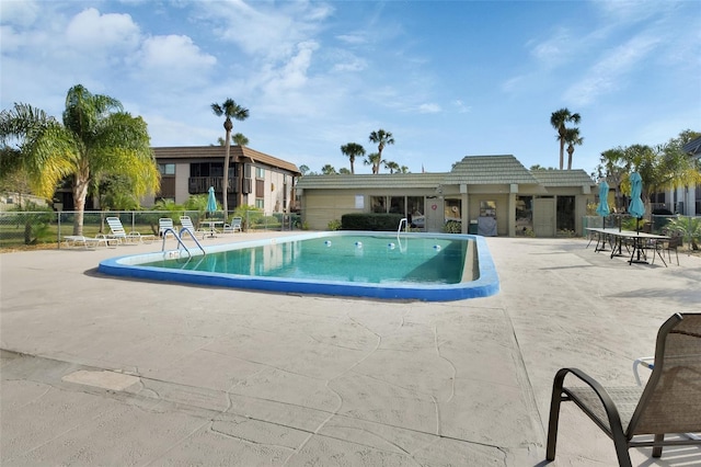 view of swimming pool featuring a patio area