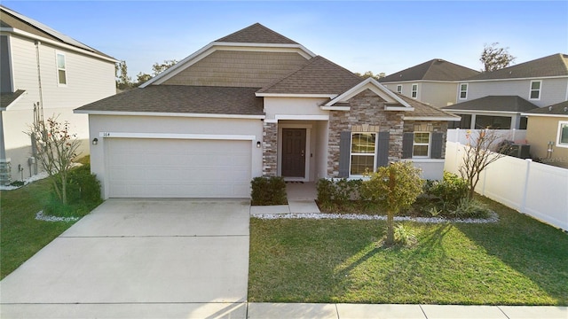 view of front of home with a garage and a front lawn