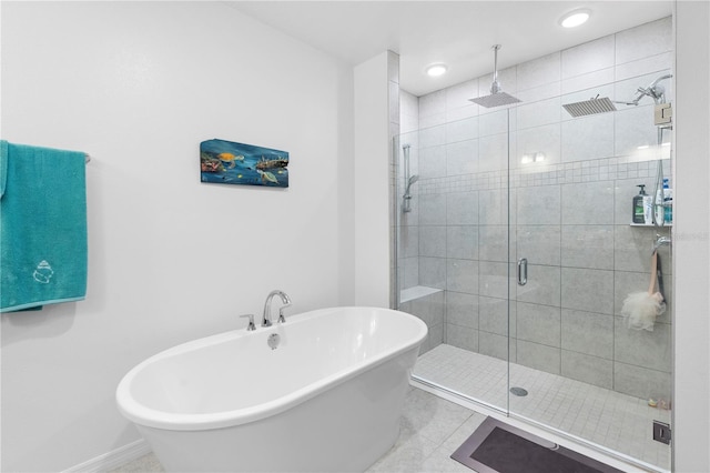 bathroom with tile patterned flooring and independent shower and bath