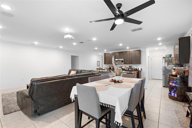 dining room with light tile patterned flooring and ceiling fan