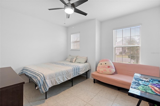 bedroom with light tile patterned floors and ceiling fan