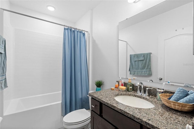 full bathroom with vanity, toilet, and shower / bath combo with shower curtain