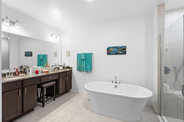 bathroom featuring vanity, separate shower and tub, and tile patterned floors