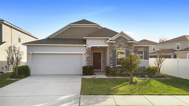 view of front of property with a garage and a front yard