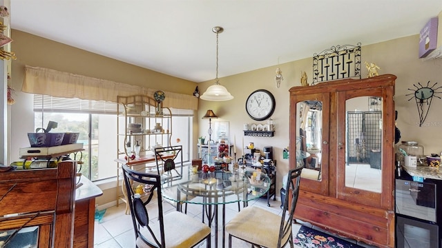 dining room featuring french doors and light tile patterned flooring