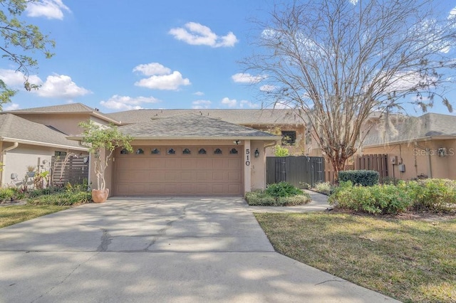 view of front of home with a garage and a front yard